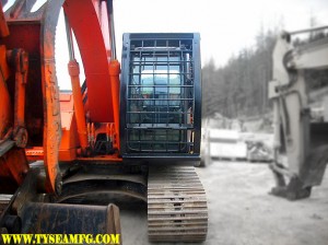 Heavy duty excavator FOPS installed with front and door screen guards