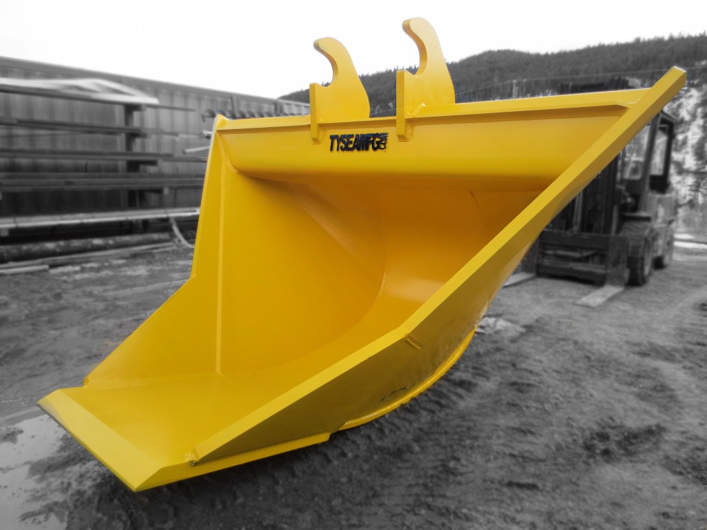 Excavator trenching bucket, painted yellow with smooth bottom edge