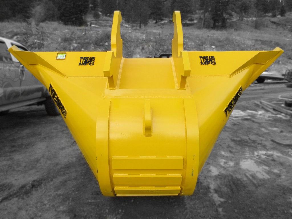 Rear side of yellow excavator v-bucket for ditching