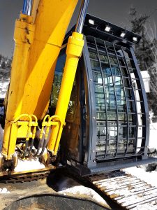 Excavator FOPS with front, side and rear screen guards for operator protection. Custom catwalks installed