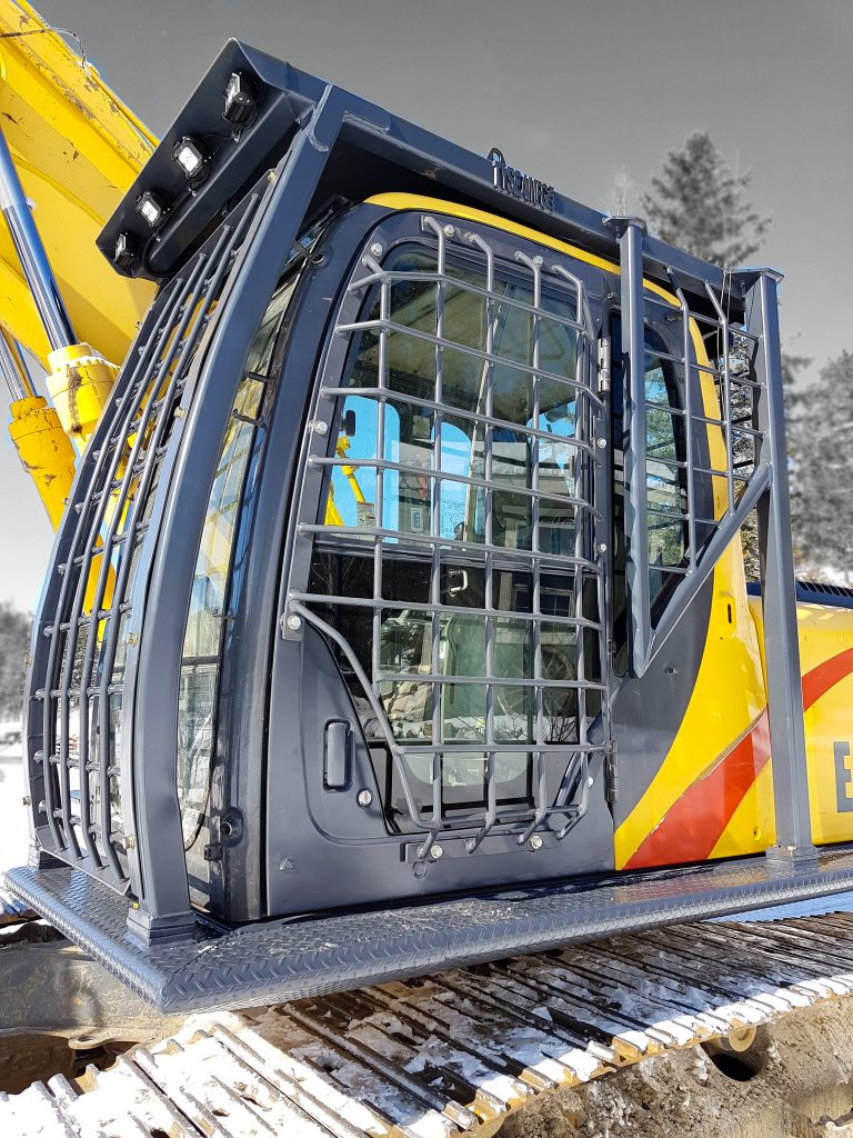 Excavator FOPS with front, side and rear screen guards for operator protection. Custom catwalks installed
