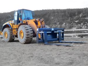 Pallet forks installed on Wheel Loader. Manufactured to cusotmer specs by Tysea Mfg