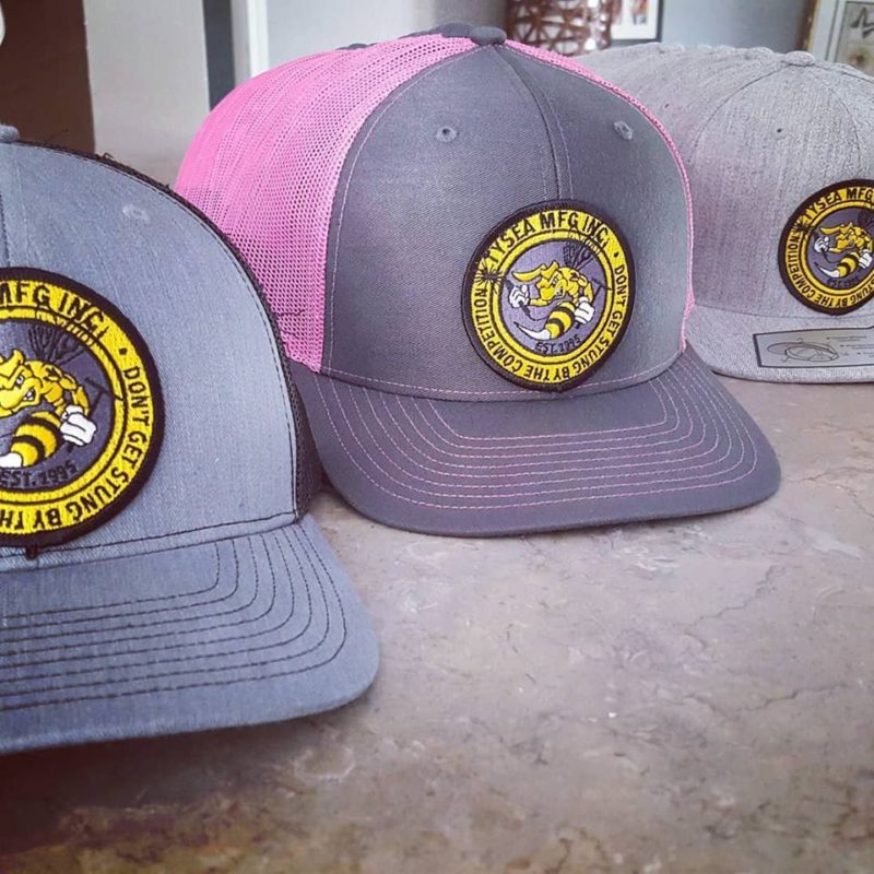 Tysea Mfg's hats with custom badges.