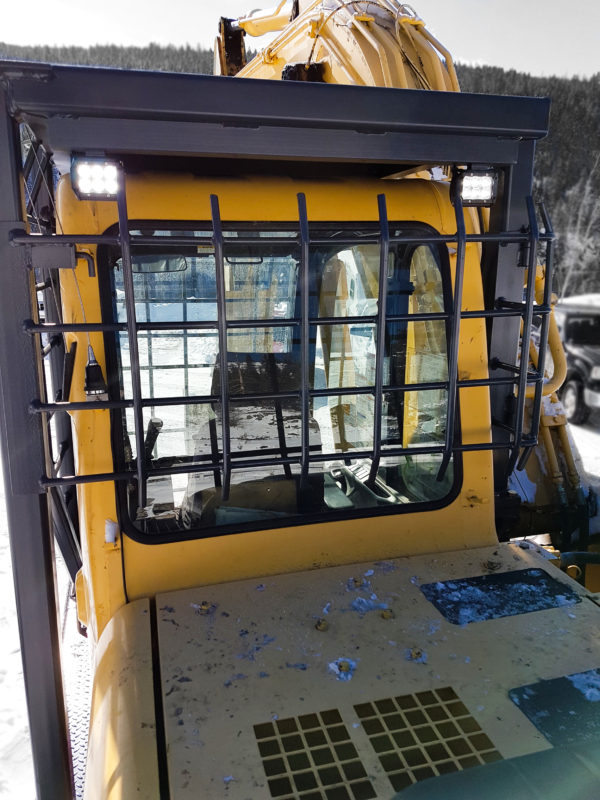 Excavator cab guarding package with rear window guarding.  Led lights installed.  Catwalks installed