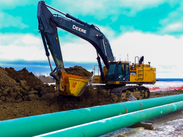 Extreme duty dig bucket installed on John Deere excavator used for pipe line