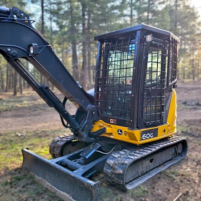 Mini John Deere excavator with FOPS and window guarding installed