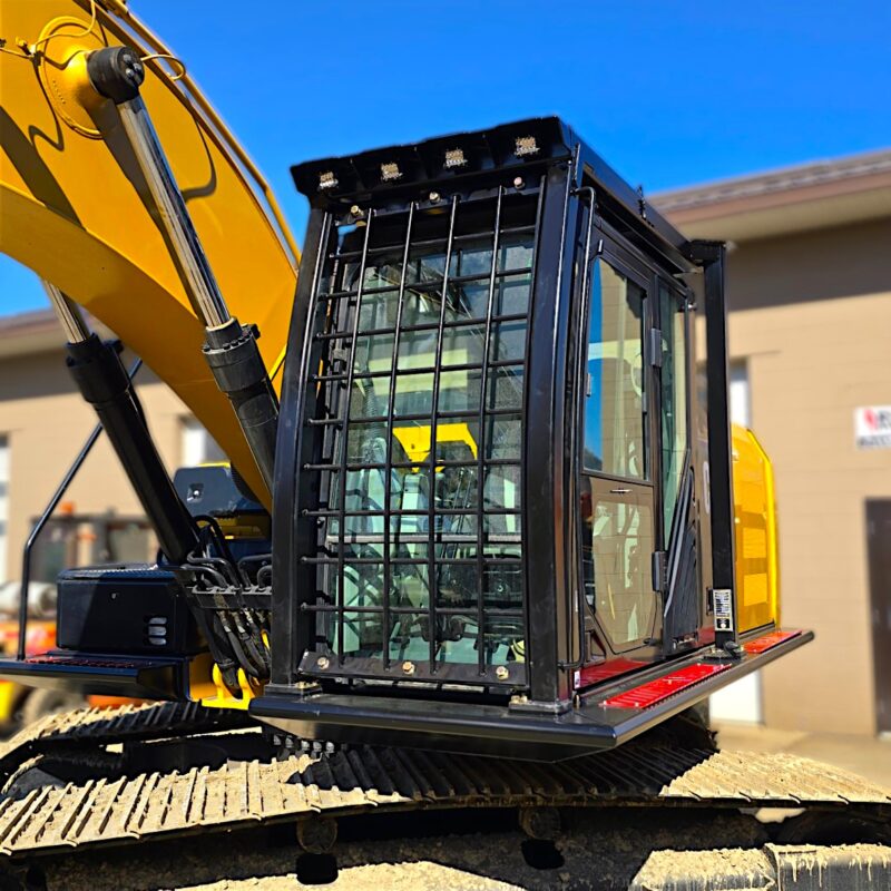 Cat excavator with FOPS cab guard and catwalks installed