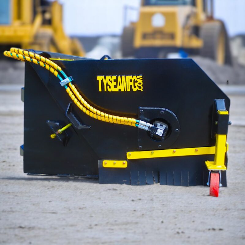 Wheel loader pickup broom with road word in background