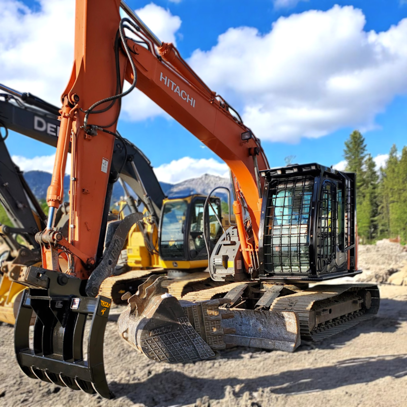 Excavator brush rake installed on Hitachi excavator for logging and forestry