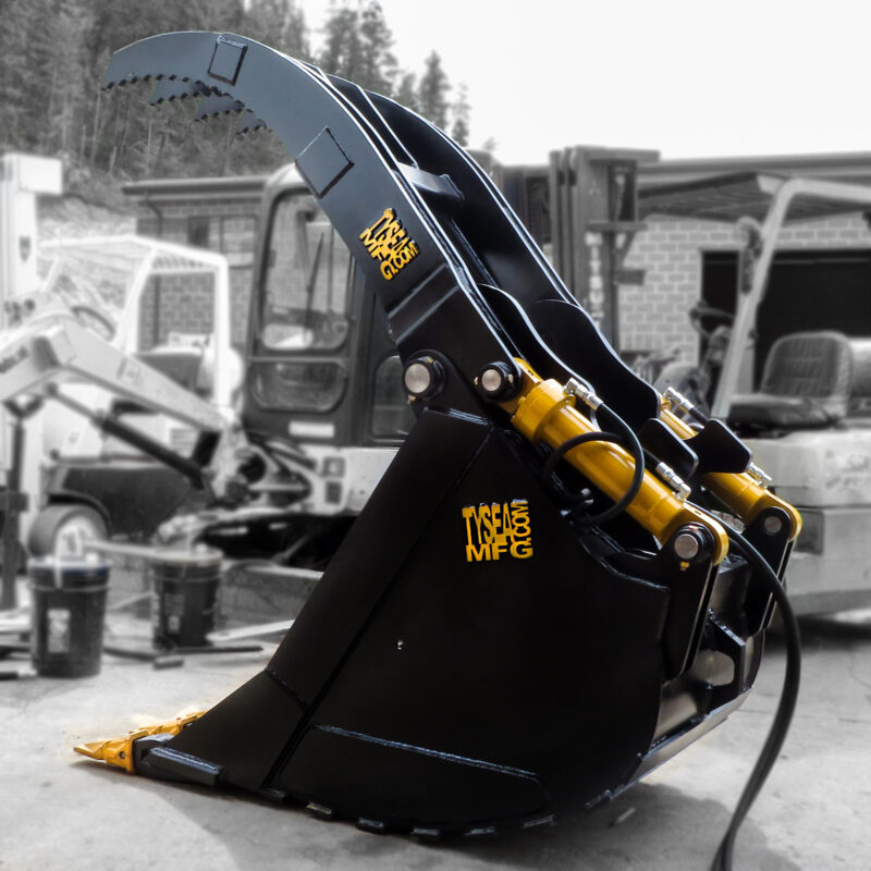 Excavator grapple bucket heavy equipment attachment going through testing prior to shipping