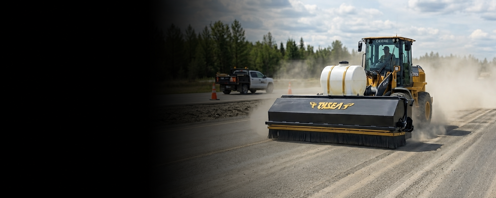 Wheel loader with pickup broom installed sweeping highway
