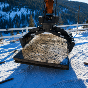 Excavator mat handler moving poly rubber swamp mat