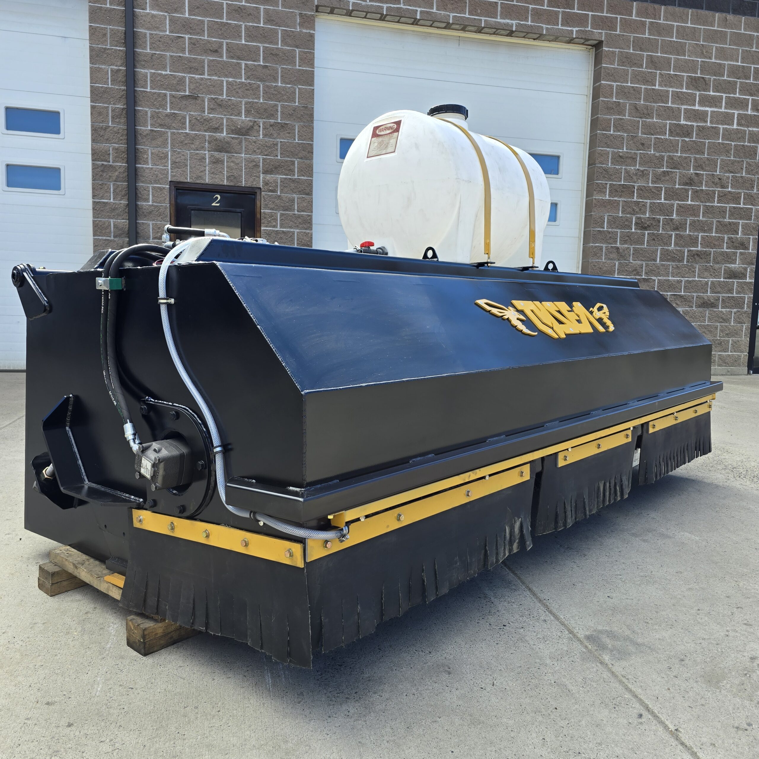 Wheel loader broom with spray systems