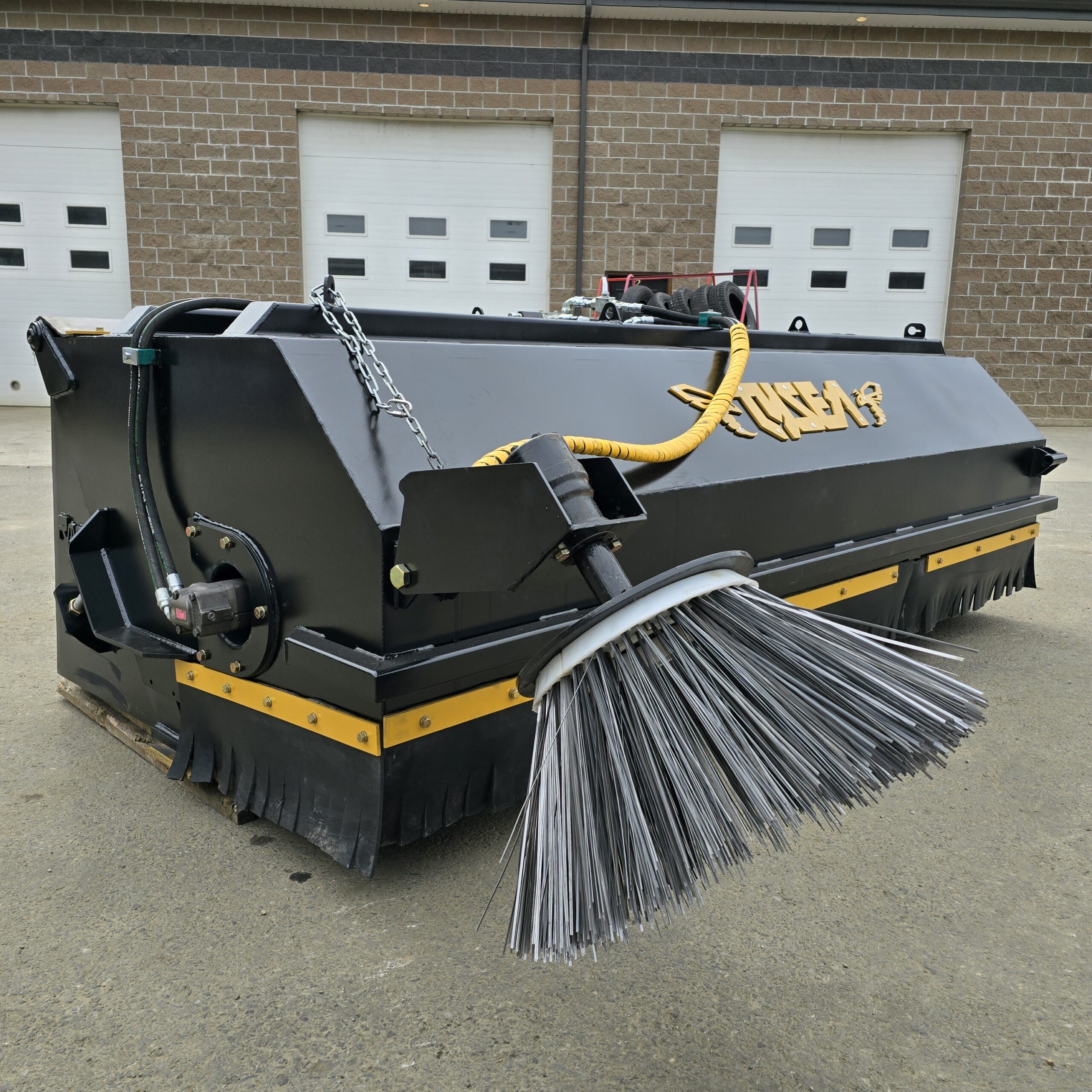 Wheel loader pickup broom with hopper bucket and tank system